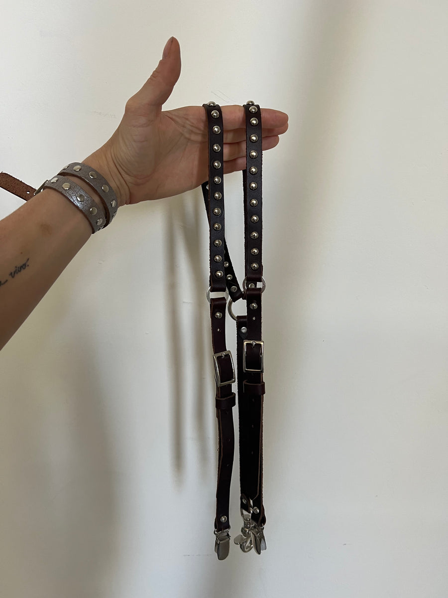 brown and silver studded skinny suspenders.